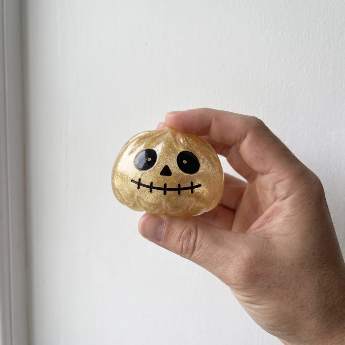 MIDAS, the gold glitter skull squishy